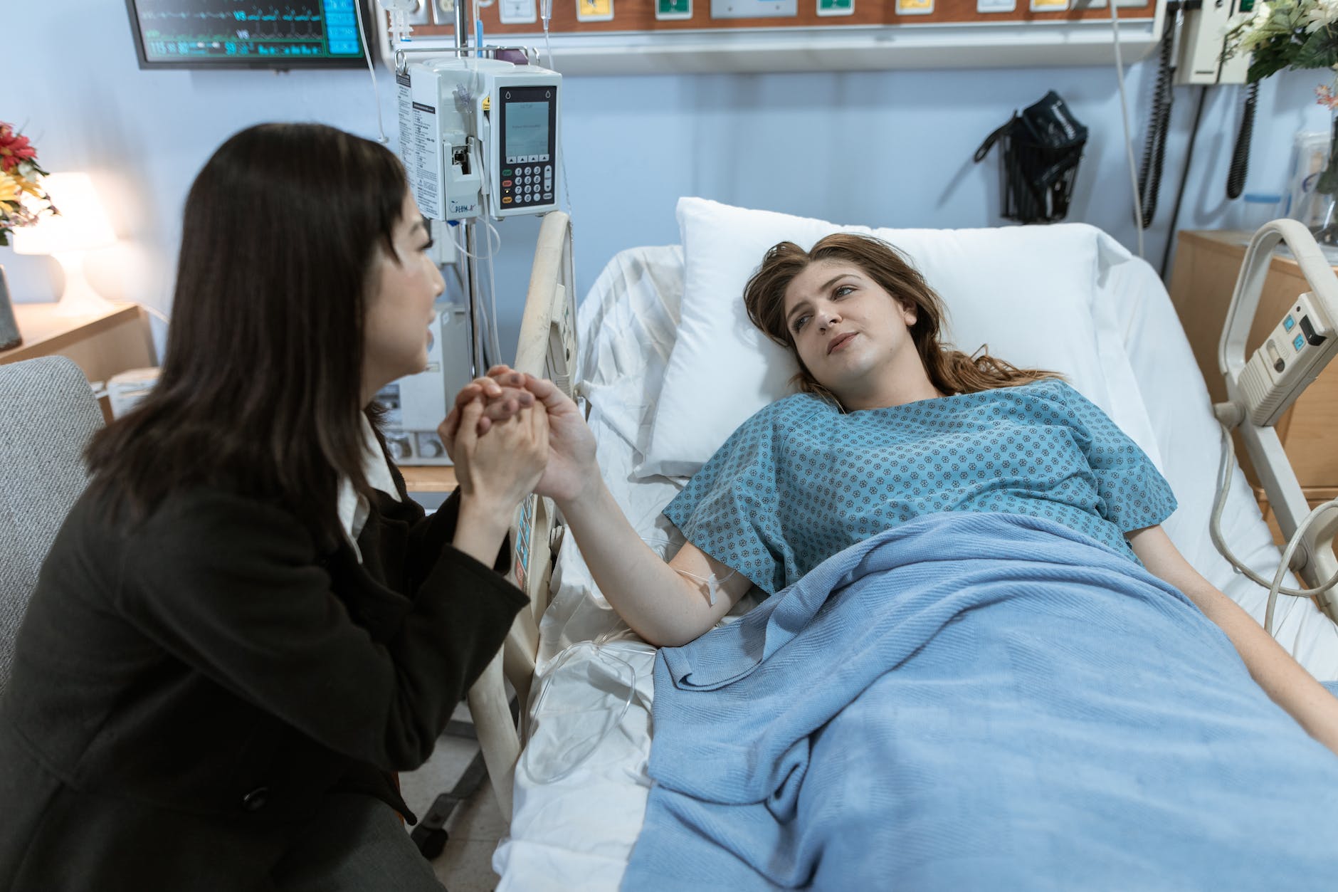 female patient visited by an acquaitance