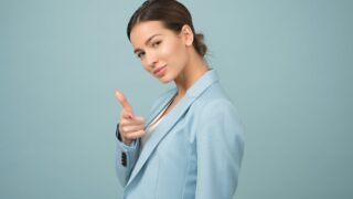 woman wearing blue shawl lapel suit jacket