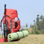 red hiking backpack on grass