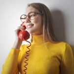 woman holding a telephone