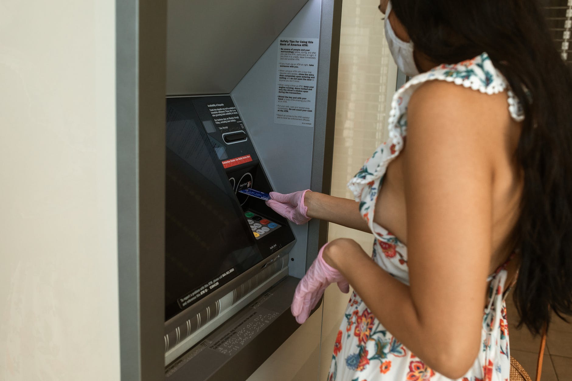 woman withdrawing money from ATM