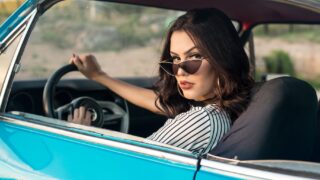 woman sitting in vehicle