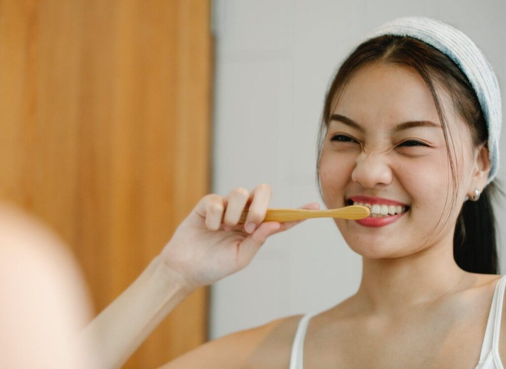 woman brushing teeth