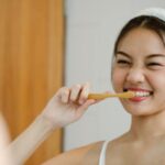 woman brushing teeth
