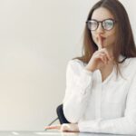 flirty young lady asking to keep secret sitting in office