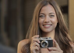 woman holing a camera