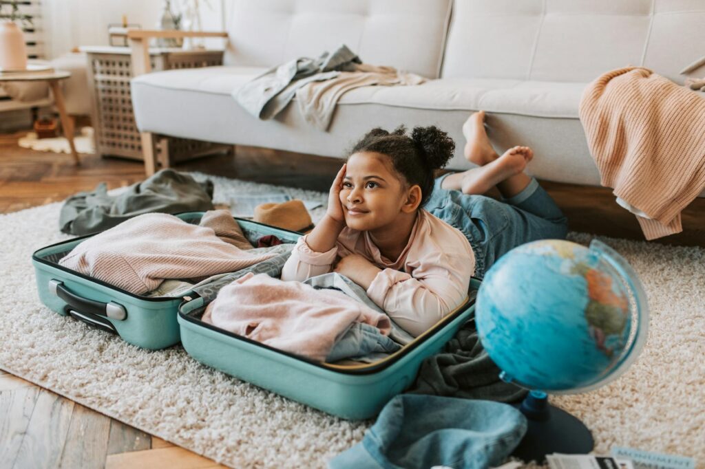 girl lying on a baggage